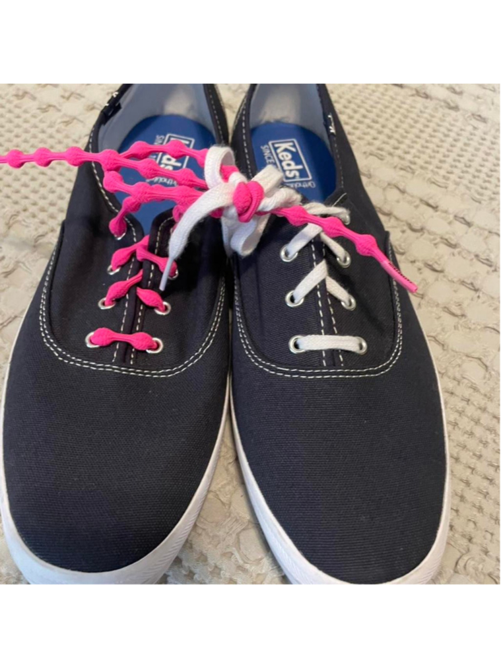 Keds navy canvas sneakers with one pink lace and one white lace #sneakers #keds